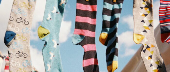 Different-colored socks on a clothesline